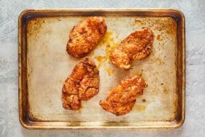 breaded fried chicken breasts coated with buffalo sauce.
