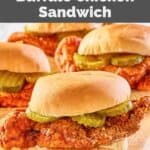 homemade wingstop buffalo chicken sandwiches on a wood cutting board.