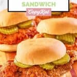 four homemade wingstop buffalo chicken sandwiches on a board.