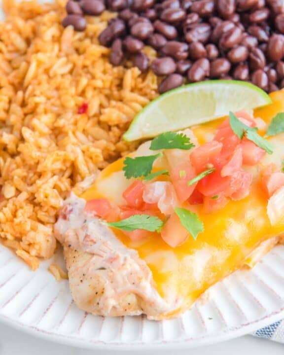 Copycat Applebee's fiesta lime chicken, rice, and black beans on a plate.