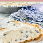 blueberry cream pie slice on a white plate.