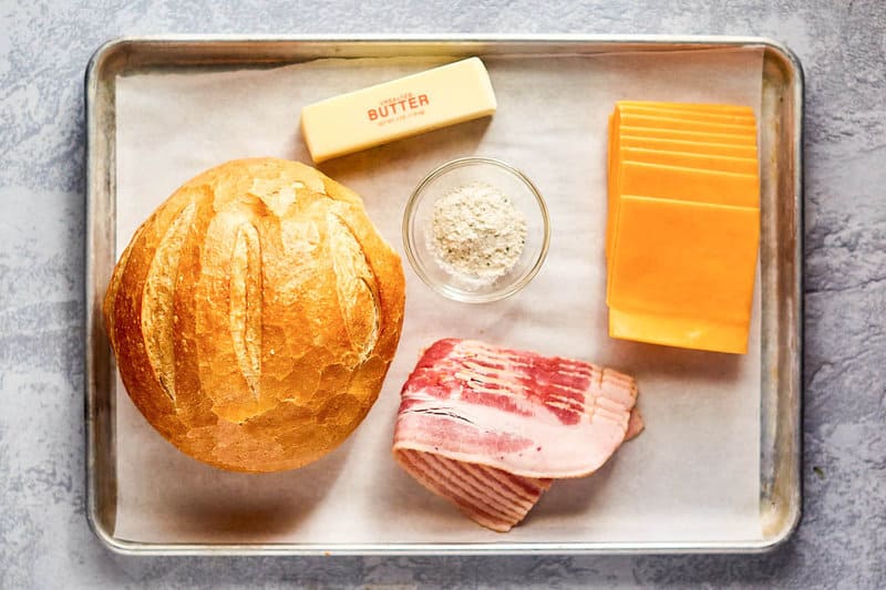 cheesy pull apart bread ingredients on a tray.