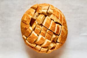 loaf of sourdough bread sliced for pull apart bread.