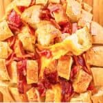 overhead view of cheddar bacon ranch pull apart bread on a board.