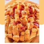 cheddar bacon ranch pull apart bread on a board.