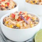 Copycat Chick Fil A chicken tortilla soup in white bowls.