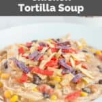 Homemade Chick Fil A chicken tortilla soup in a white bowl.