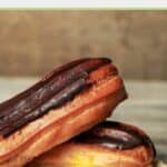 two chocolate topped eclairs.