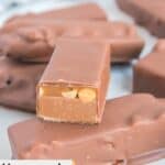 homemade snickers bars and one cut in half to show the inside.