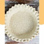 overhead view of homemade pie crust with scalloped edges.