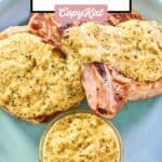 overhead view of mustard cream sauce on pork chops and in a small bowl.