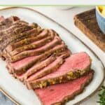 Sliced New York Strip Roast on a platter.