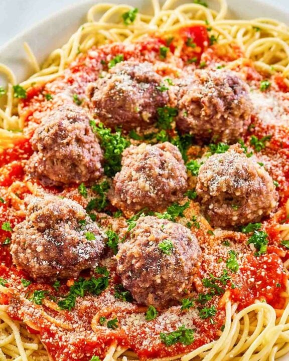 Copycat Olive Garden spaghetti and meatballs on a platter.