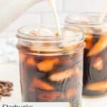 pouring creamer into homemade Starbucks cold brew coffee.