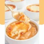 homemade TGI Friday's French onion soup on a spoon over a bowl of it.