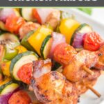 Air fryer chicken kabobs on a white plate.