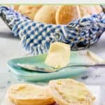 Angel biscuits and butter in a butter dish.