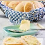 Angel biscuits with butter and in a basket.