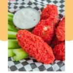 Homemade Applebee's Flamin Hot Cheetos wings in a basket with ranch and celery.