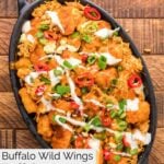 Overhead view of homemade buffalo chicken tots in a black dish.