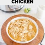 A bowl of homemade Cafe Rio shredded chicken and limes.