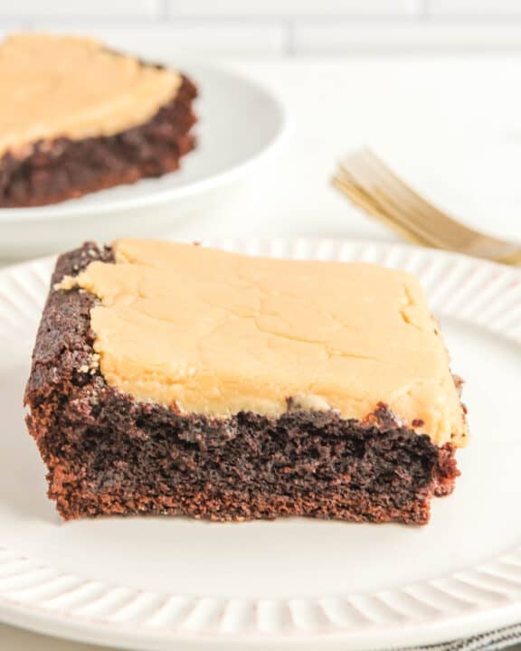 Chocolate caramel cake slices on plates.