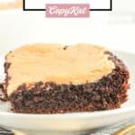 Chocolate caramel cake slice and two forks.