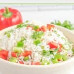 A bowl of cilantro rice and a red bell pepper.