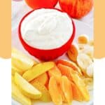 Cool whip fruit dip in a bowl next to fresh fruit.