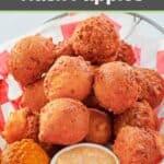 Homemade southern cornbread hush puppies and dipping sauce in a basket.