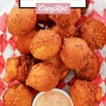 Overhead view of homemade southern hush puppies in a basket.
