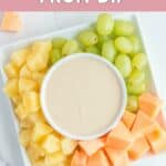 Overhead view of homemade Jason's Deli fruit dip and fresh fruit on a plate.