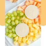 Overhead view of a fruit platter with homemade Jason's Deli fruit dip.