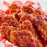 Homemade KFC honey barbecue chicken wings in a basket.