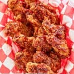Overhead view of homemade KFC honey barbecue wings in a basket.