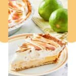 A slice of key lime pie with meringue on a plate and two limes.
