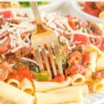 A plate of homemade Olive Garden Neapolitan ziti and a fork in it.