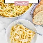 Overhead view of one pot chicken alfredo pasta and bread.