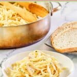 Homemade chicken alfredo pasta in a pot and on a plate.