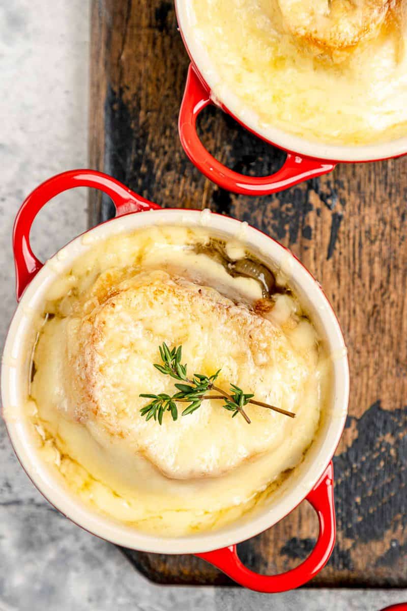Overhead view of onion soup gratinee in bowls.