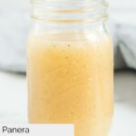 Homemade Panera fuji apple salad dressing in a glass jar.