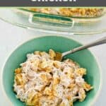 Poppy seed chicken casserole serving and a fork in a green bowl.