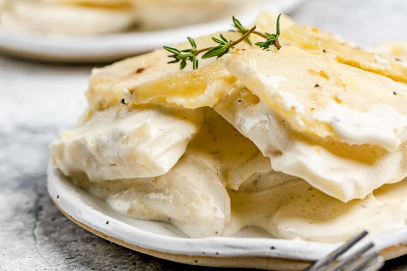 Creamy scalloped potatoes without cheese on a plate.