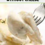 Closeup of scalloped potatoes without cheese on a fork.