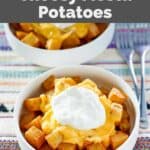 Copycat Taco Bell cheesy fiesta potatoes in bowls and two forks next to them.