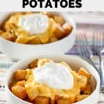 Homemade Taco Bell cheesy fiesta potatoes and forks.