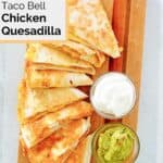 Overhead view of copycat Taco Bell chicken quesadilla, sour cream, and guacamole.