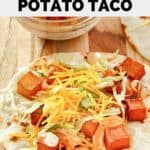 Homemade Taco Bell spicy potato taco on a wood board.