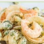 Closeup of homemade tempura batter fried shrimp and assorted veggies.