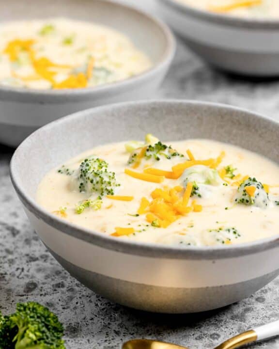 Three cheese broccoli soup in three bowls.